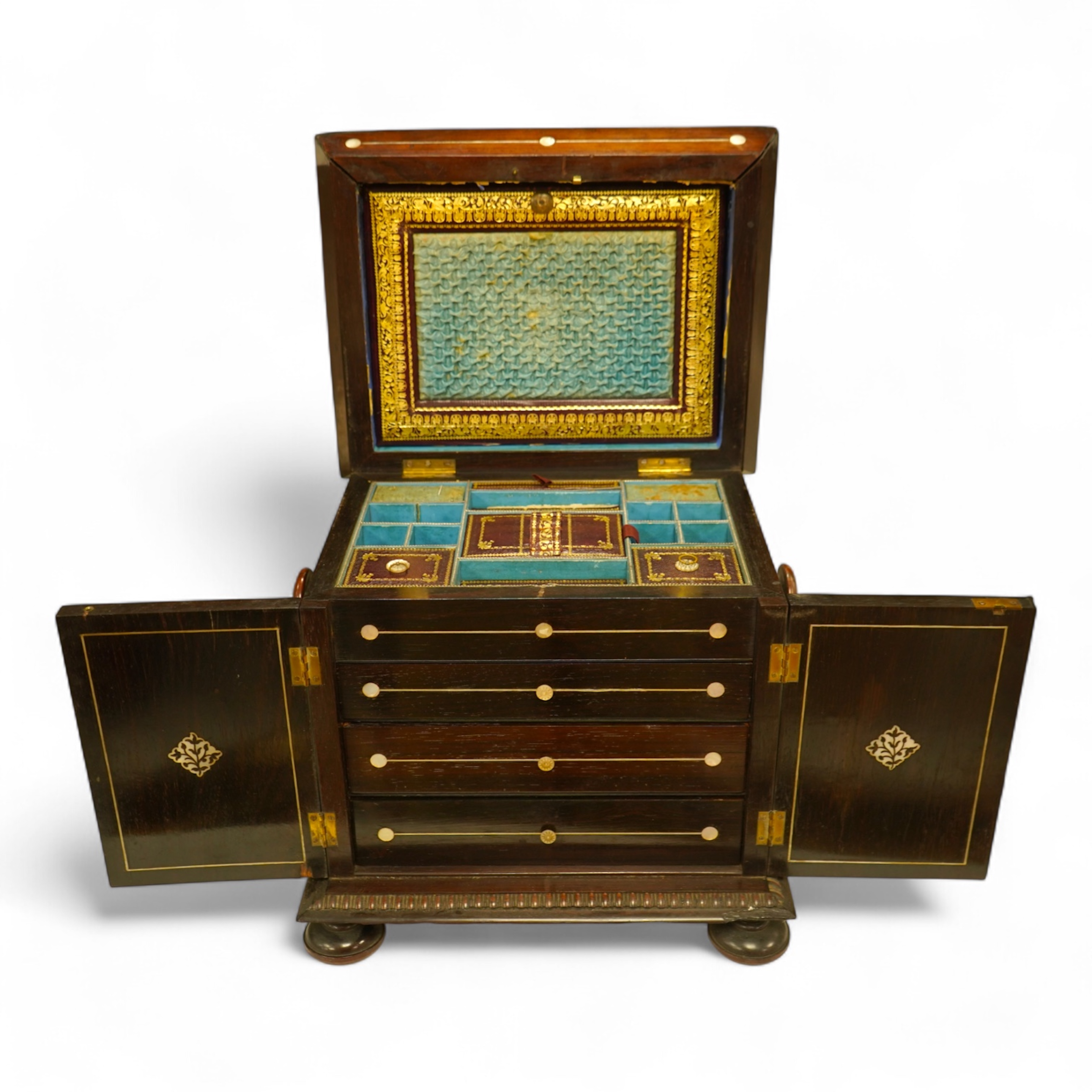 A William IV rosewood and mother of pearl inlaid sewing and writing cabinet with tooled Moroccan leather fitted interior, 37cm high